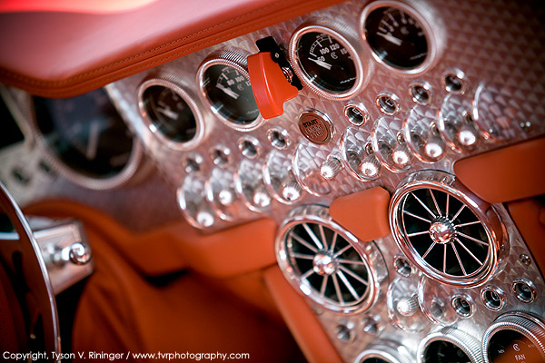 The instrument panel of the Spyker Aileron showcases guarded switches 